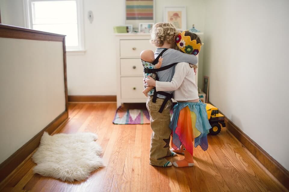 Two children hugging while playing